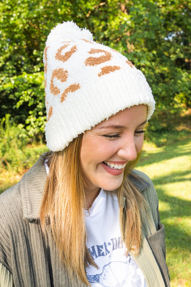 COZY CUDDLES SNOWY LEOPARD POM POM BEANIE